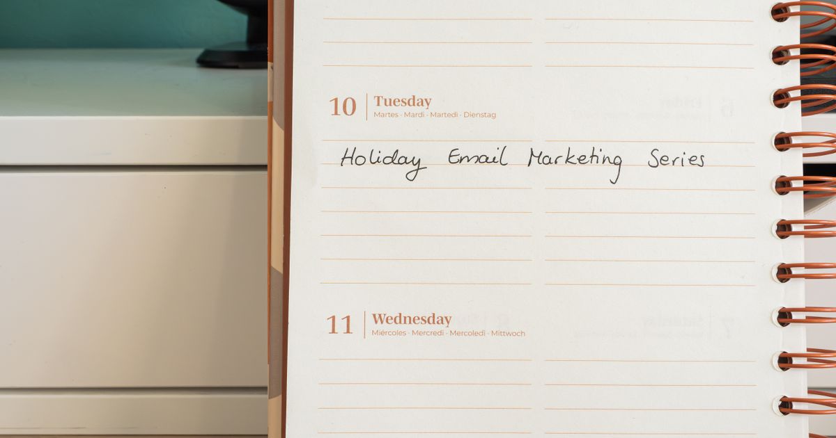 A planner open on a desk with a handwritten email marketing series note, illustrating how to plan an email sequence